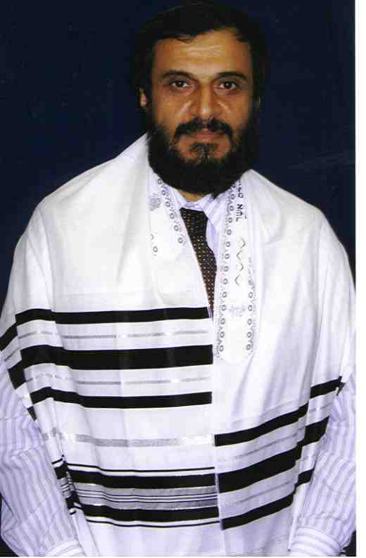 A man in a prayer shawl with black stripes according to the Orthodox Ashkenasic tradition