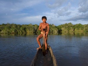 Native Amazon Indian on Kayak, Celebrate Death with Life