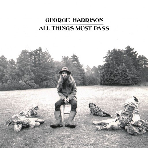 George Harrison sitting in a field with text in the sky that says all things must pass
