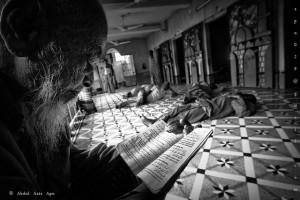 A man reads a religious text in a mosque 