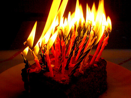 Too many birthday candles on a cake for too many years old