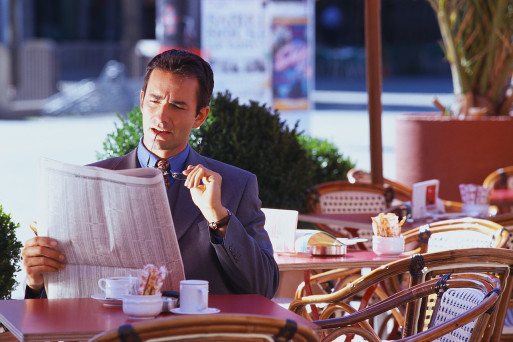 Businessman Reading Newspaper reflecting about life