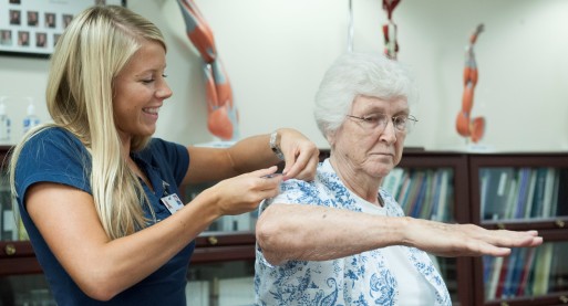 elderly woman getting occupational therapy