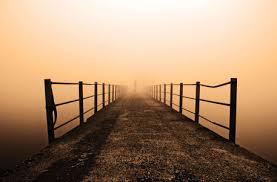 Like death, a bridge disappearing into the fog