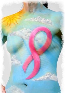 body paint depicting a pink ribbon on a sky background 