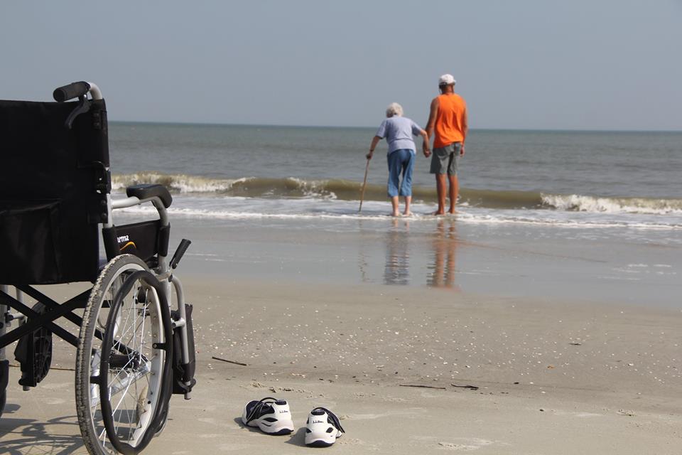 Norma walking on the beach with her son in Florida
