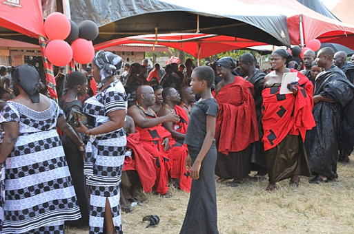 Mourning Ghanians in red, black and white attire