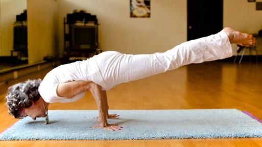 Strong senior woman practicing yoga 