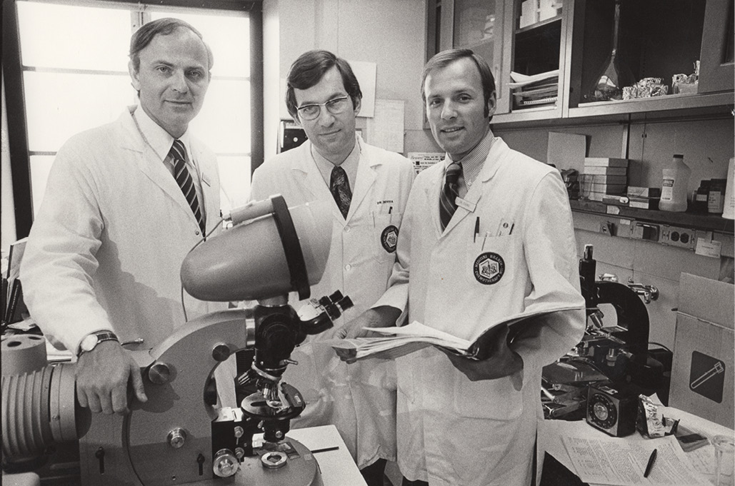 Vincent DeVita and three colleagues work on a cure for cancer