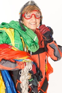 elderly woman in skydiving gear enjoying life to the fullest