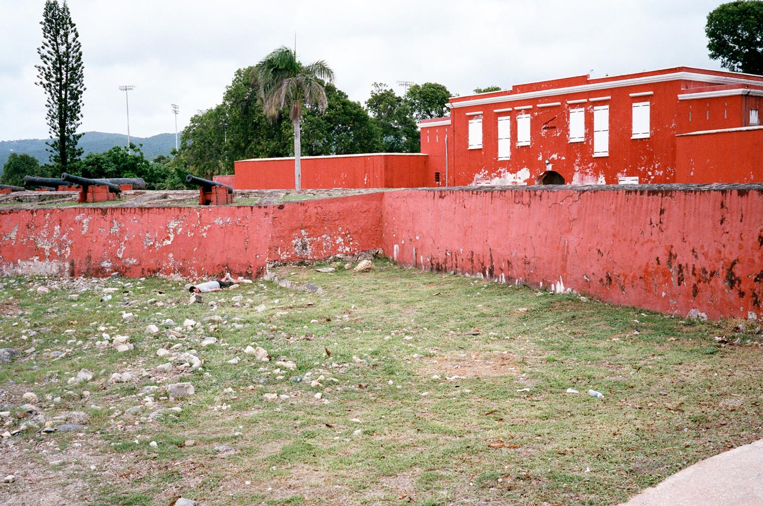 Self-portrait depicting death in the courtyard of a crumbling building in St. Croix