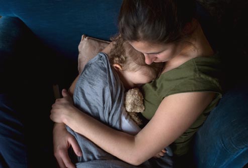mother hugging child shedding tears over a death