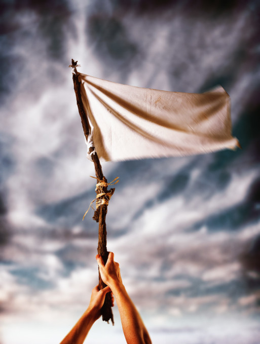 flying a white flag of surrender to suffering