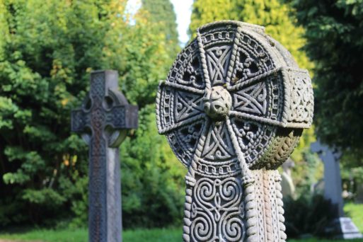 Grave marker of stone in shape of Celtic cross