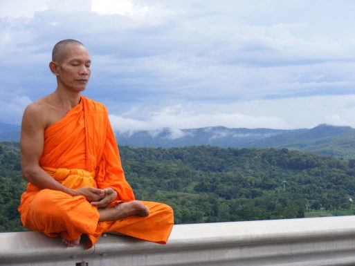 Buddhist monk meditating about death