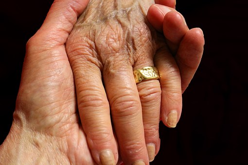 elderly hands healing touch