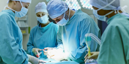 doctors perform surgery