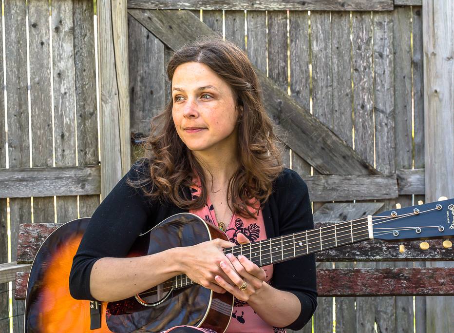 May Erlewine author of Shine On with her guitar