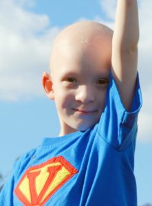 A child with cancer wearing a super hero costume