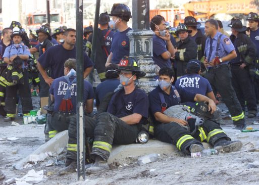 Firemen resting in the rubble during 9/11 clean up