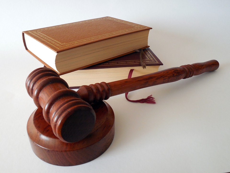 A judge's hammer and a set of law books used in probate court