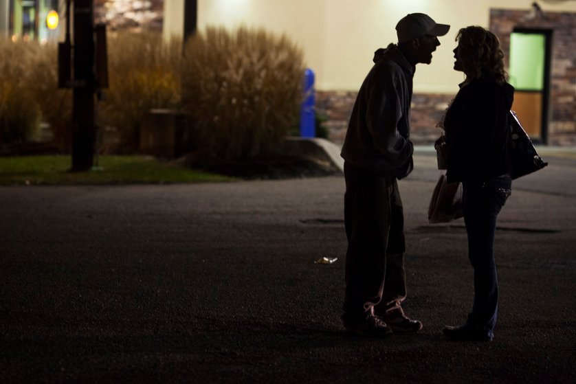 Maggie and shane argue outside a fast food restaurant.