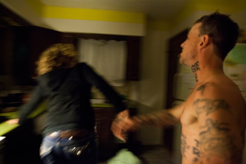 Shane shoves Maggie violently across the room