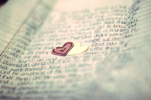 A handwritten last letter with two heart stickers attached. 