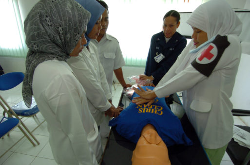 Nurses practice CPR on a dummy to prepare for treating patients who do not have full DNR orders