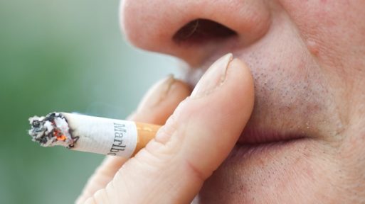 Man smoking a cigarette leads to cancer deaths