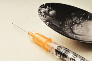 Syringe and spoon used by IV drug users