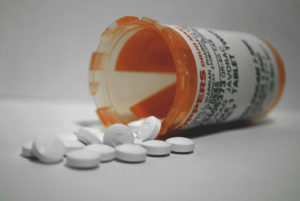 A bottle of pain-reducing pills, often given to palliative care patients