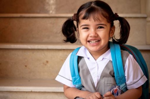 A school age girl with backpack may need childcare after a loss