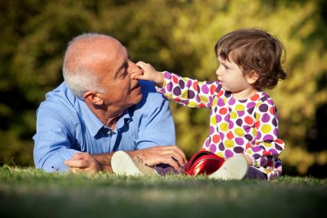 A senior man's need for support is met by spending time with his grandchild outdoors