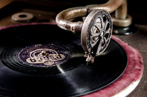 An old phonograph playing a record to drown out the death rattle