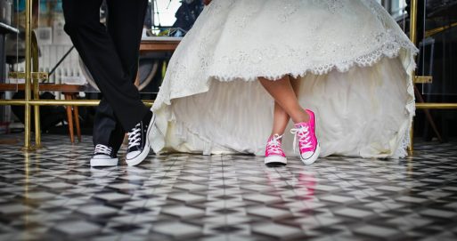 Shoes of hip bride and groom at funeral home weddings 