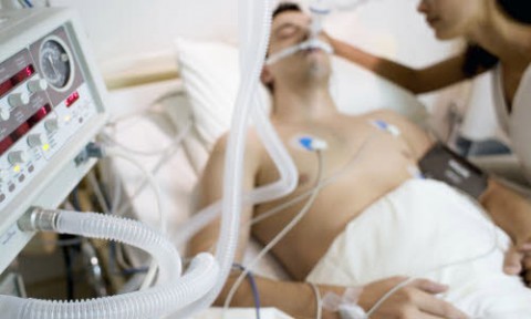 Person in an ICU on a ventilator at the end of life 