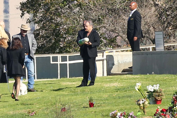 Carrie Fisher's brother holding her Prozac-shaped urn