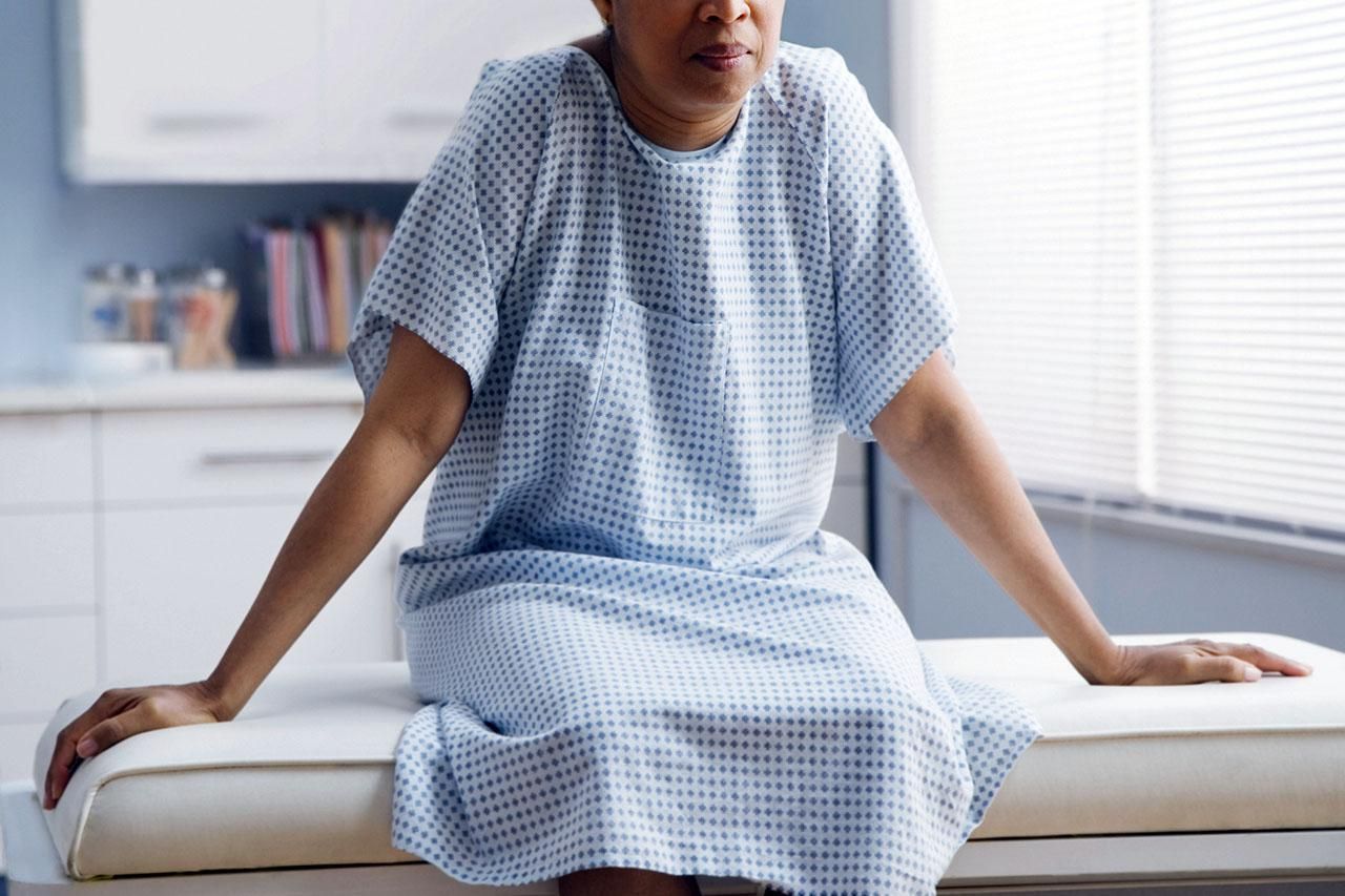 Woman in a hospital gown 