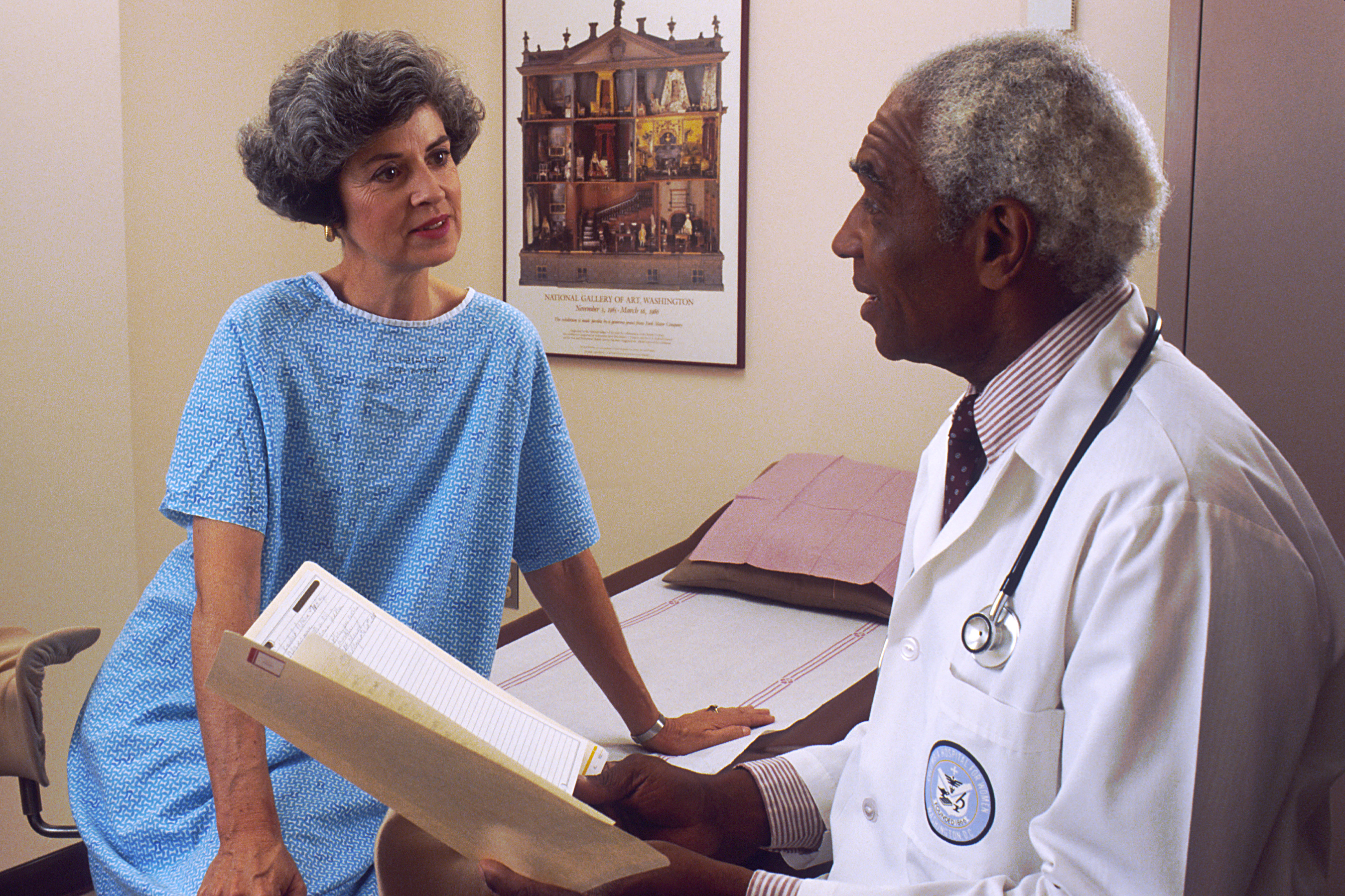 A doctor speaks with a woman about her end-of-life care options
