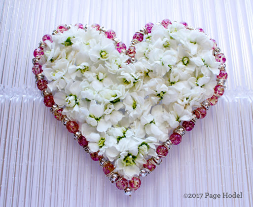 handmade heart of white and pink flowers