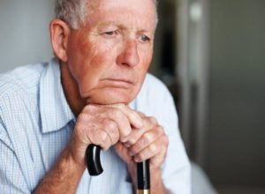 Loneliness on the face of an elderly man