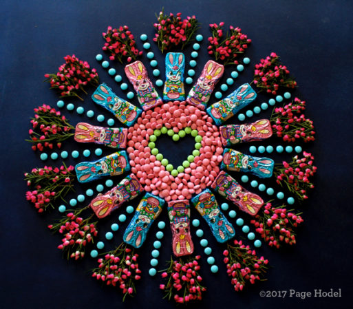 Handmade heart made of Easter candies and flowers