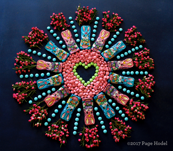 Handmade heart made of Easter candies and flowers