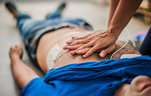 A person performing CPR blurs the line between life and death