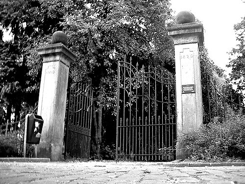 Opened cemetery gate symbolizing that people have entered the cemetary