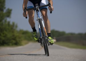 Person riding a bike symbolizing a healthy lifestlye