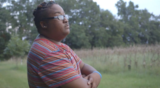 Kendrick Evans standing in a field looking outwards thinking about his illness as seen in "My Last Days"