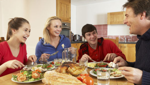 Family avoiding obesity by eating a healthy meal