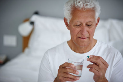 Man taking a pill to demonstrate placebo effect